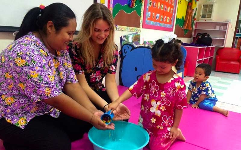 a TEFL teacher and her students in the classroom